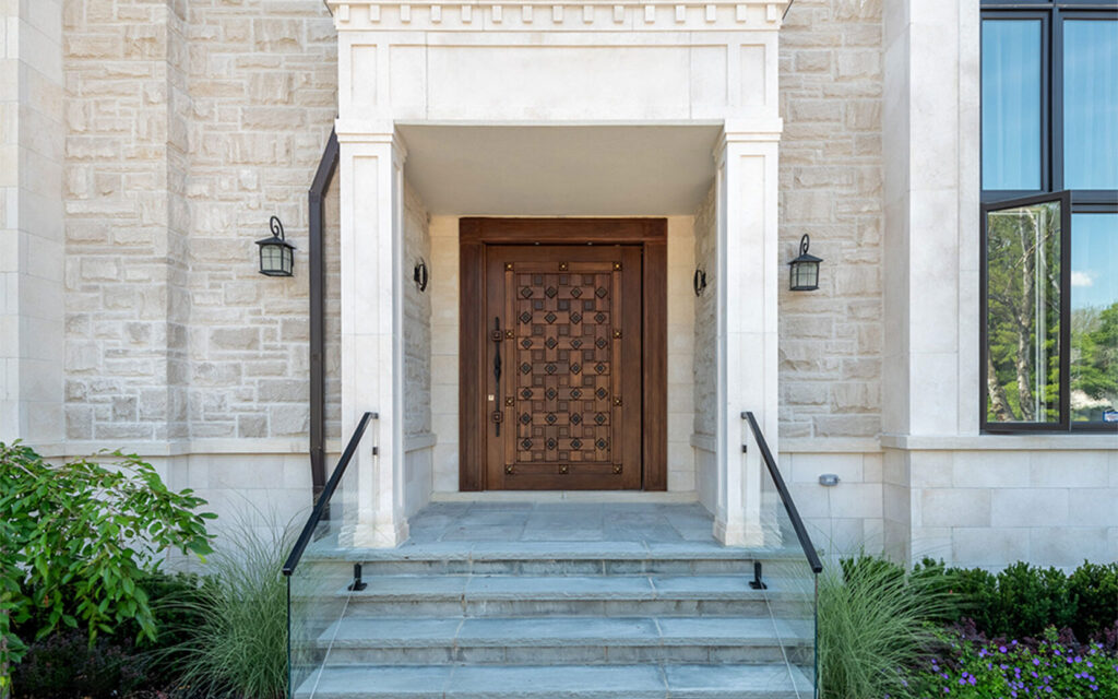Solid wood door, reminiscent of a chessboard with different intricate shades of brown. 