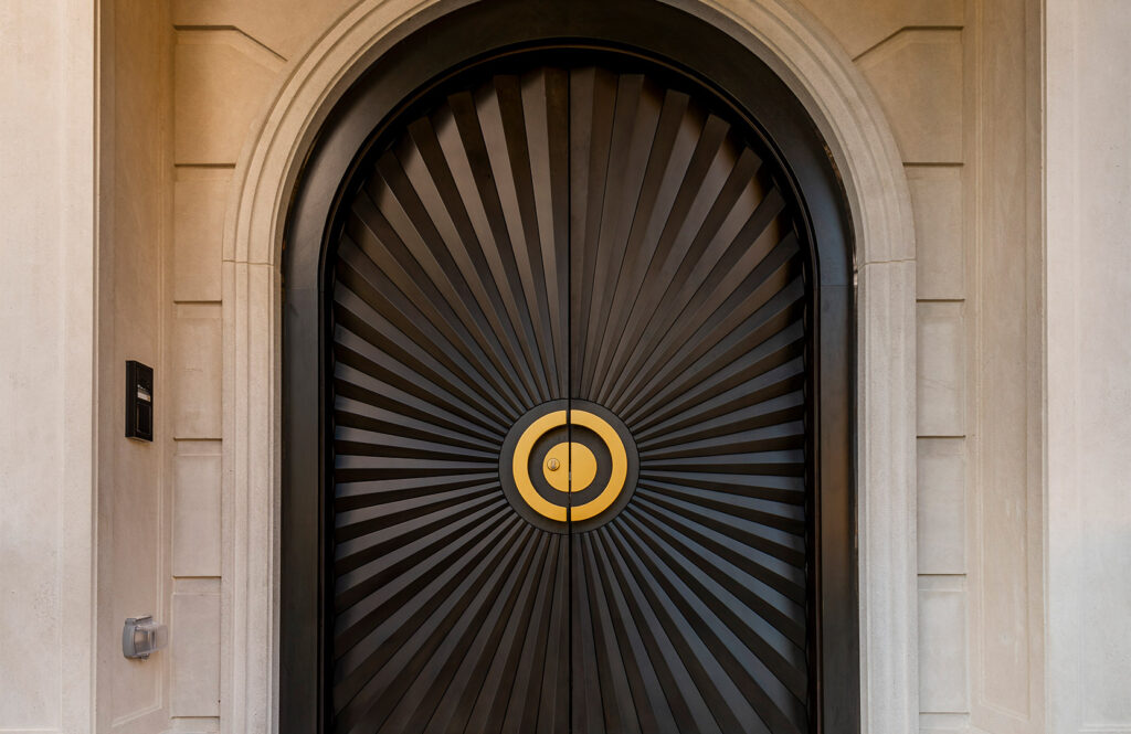 Custom wood door presents a unique pattern of scalloped solid wood